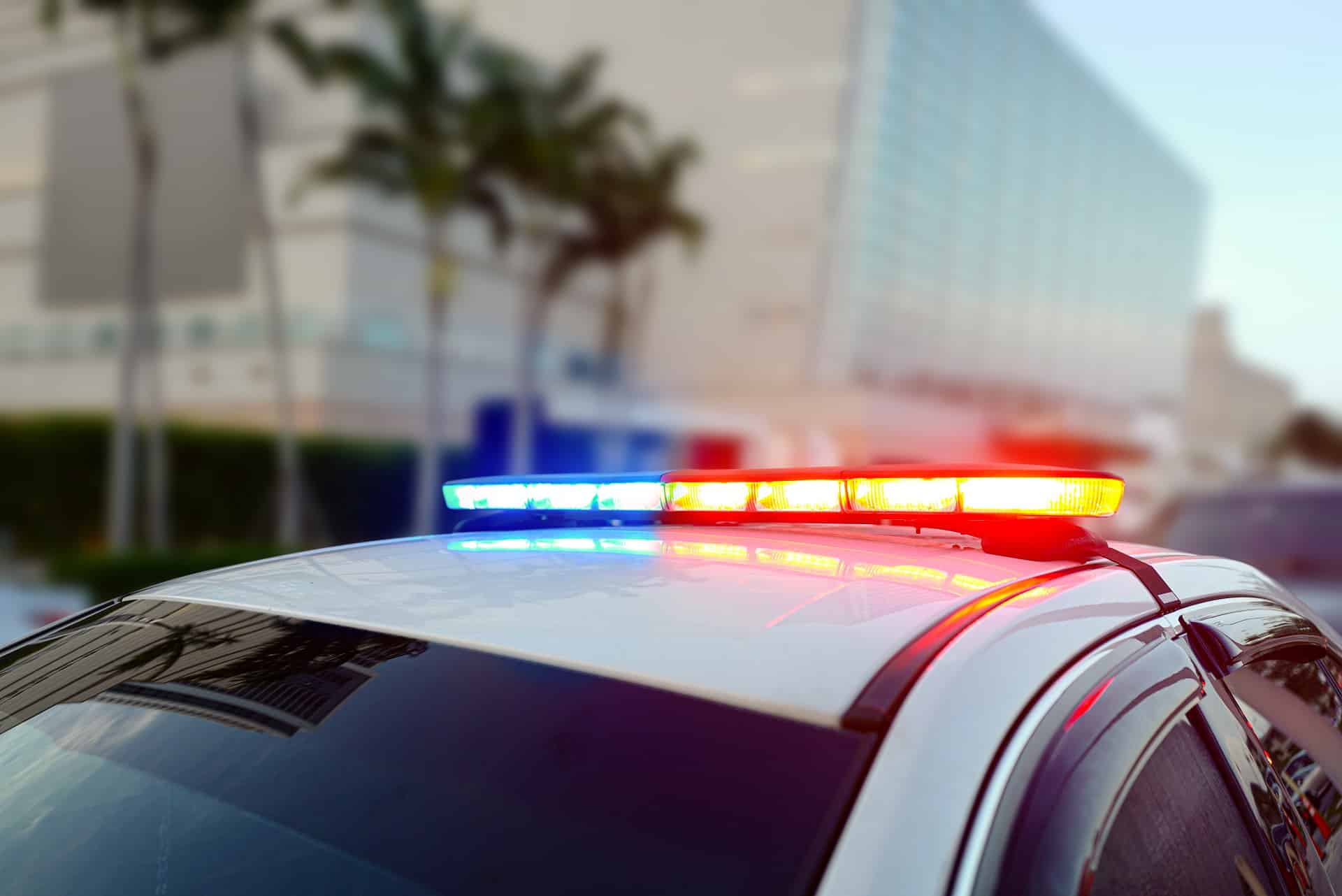 A Police Car With Flashing Lights On Top | Law Offices Of David M. Wallin
